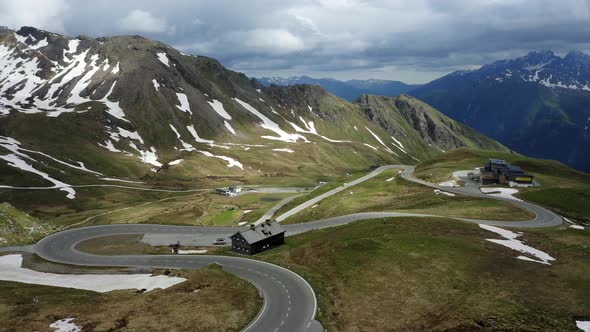 Aerial Circle Footageof Grossglockner Mountain Pass and Old Hut in Austria