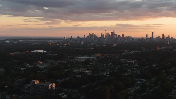 A sunset over Toronto. City skyline as seen from the distance. Cloudy sky