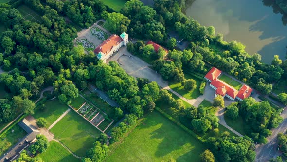 Beautiful avenue of trees of Nieborow Palace, a Baroque style residence in Poland. Colourful foliage