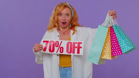 Cheerful Redhead Girl Showing Shopping Bags Up To 70 Percent Off Inscriptions Banner Black Friday