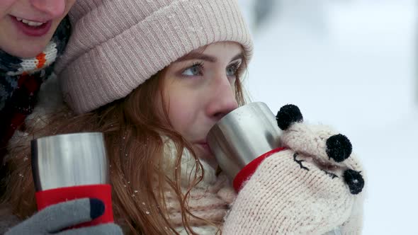 Couple Drinking Tea Coffee Cup in the Winter