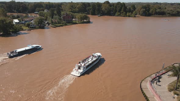 Aerial view of two catamarans sailing Luján river at Tigre, Buenos Aires. Dolly In