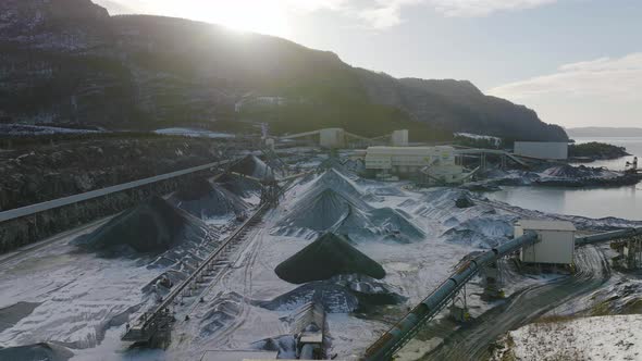 Wide angle establishing aerial shot of a mining quarry. Fossil fuel and global warming issues