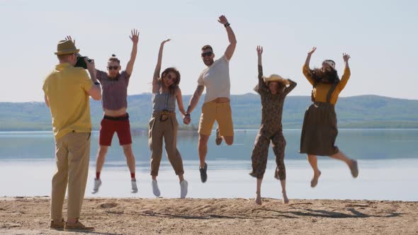 Young People Jumping when Posing for Picture