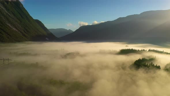 Morning Mist Over the Valley Among the Mountains in the Sunlight