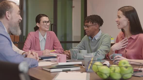 Colleagues Having Talk in Conference Room