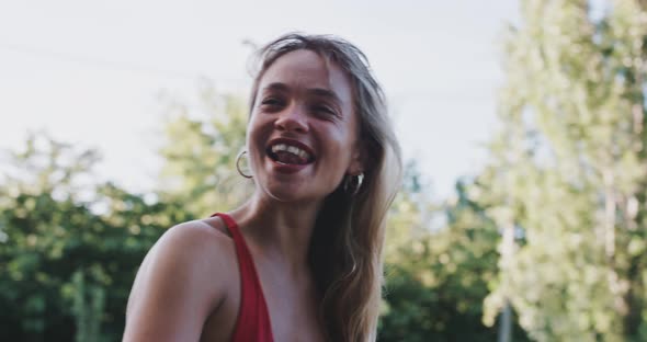 Young woman with red lipstick smiling