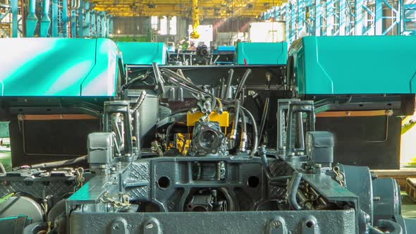 Conveyor Assembly Stage the Body of Tractor at Big Industrial Factory Timelapse