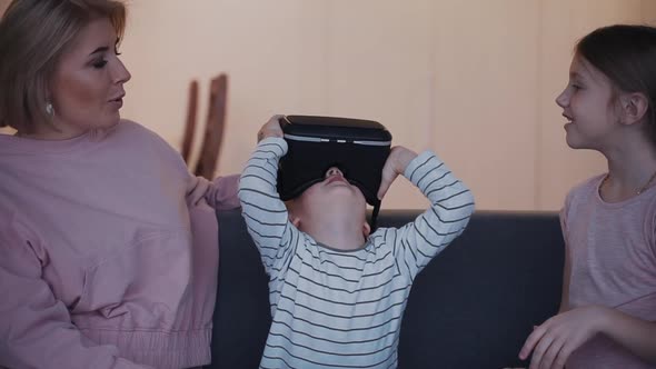 Cheerful Son Is Wearing New 3d Virtual Reality Device for Vr Gaming.