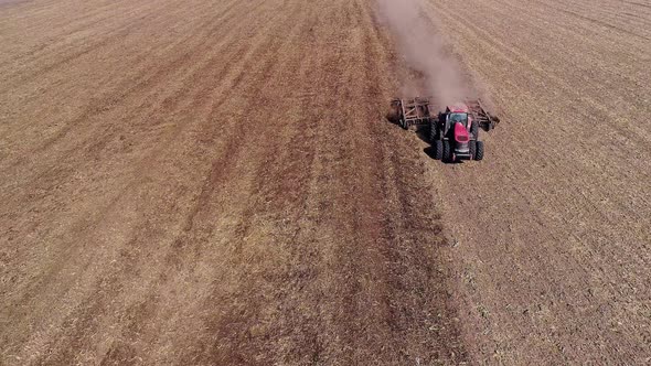 Agricultural Tractor Cultivating Field