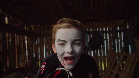 Boy in Halloween Vampire Costume Frighten