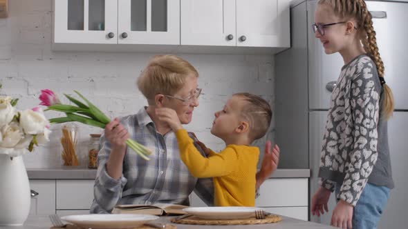 Caring Kids Congratulating Grandma on Women's Day