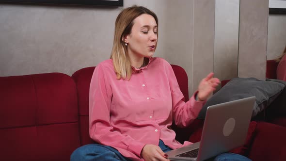 Hypocritical Woman Video Call With Laptop at Home Sofa Concept