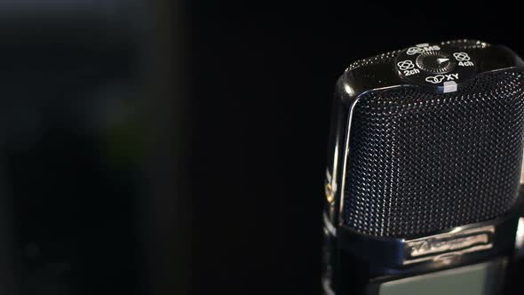 Closeup of a Microphone to Record Sound on Black