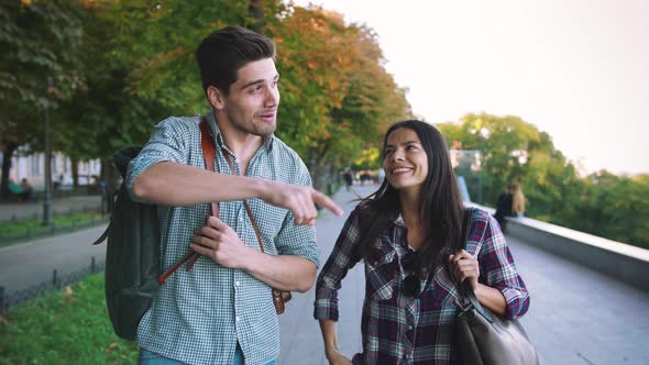 Young Mixed Race Tourist Couple Walking Through the City and Having Some Fun Slow Motion