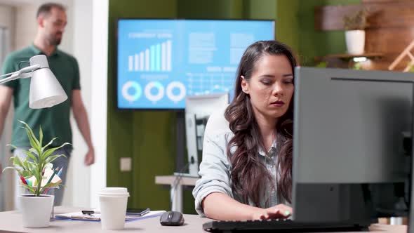 Revealing Shot of a Busy Office with People Working in It