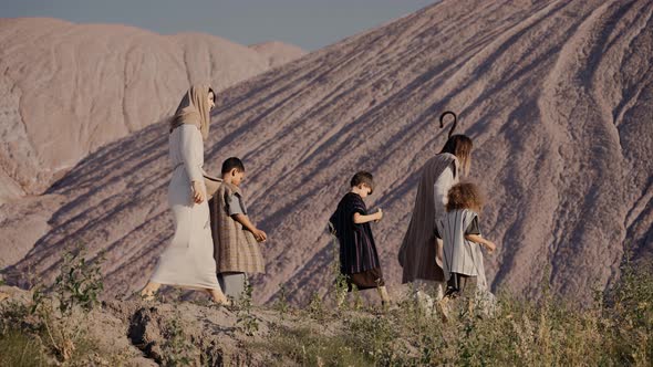 Jesus with a Staff and Children Walks Up the Hill