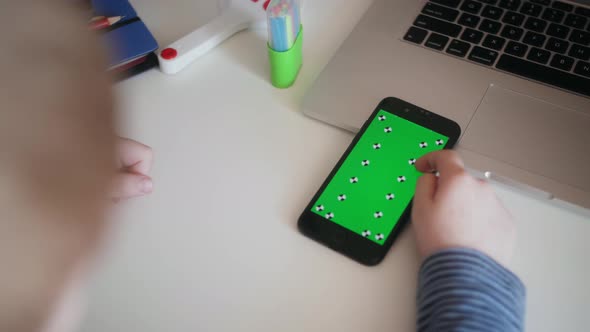 Closeup Hand of Kid Boy with Smartphone