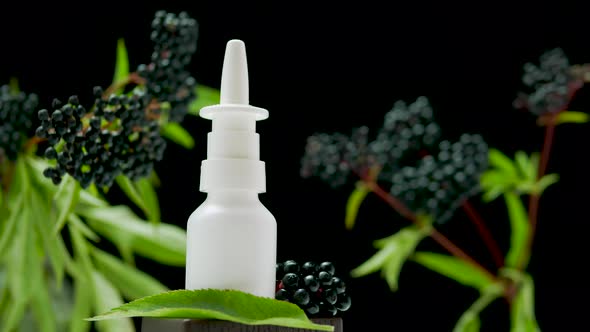 Nasal Spray With Black Berry On A Black Background, Homeopathic Treatment, Medical Nasal Spray