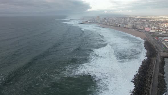 4k video of waves of the Sea crashing on the sandy shore in the evening