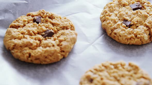 Freshly baked cookies on wax paper 4k