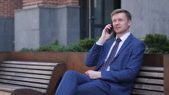 Phone Talk Businessman Attending Call at Work