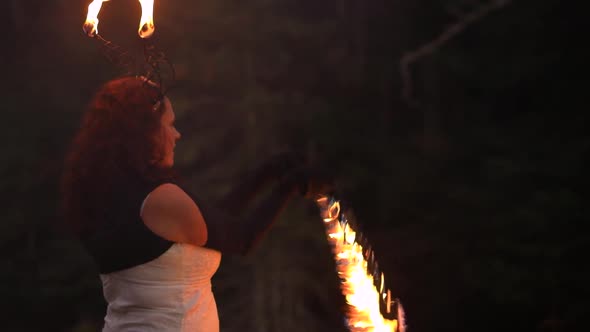 Beautiful Woman Performing Fire Spinning