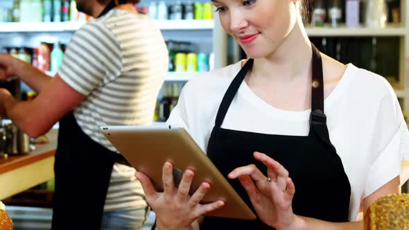 Waitress using digital tablet