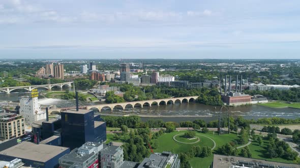 Drone aerial view of Stone Arche bridge in Minneapolis, MN in the summer