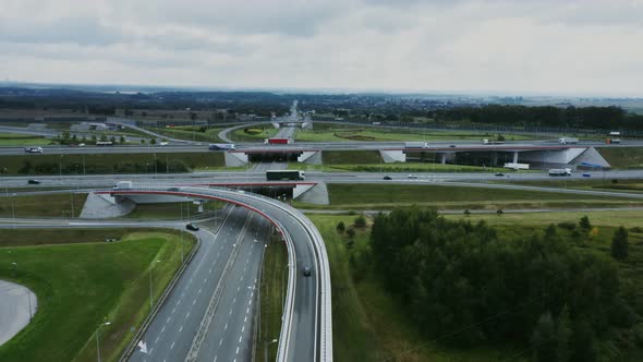 Video Filming From a Drone View of the Road Junction with Cars Moving Along It