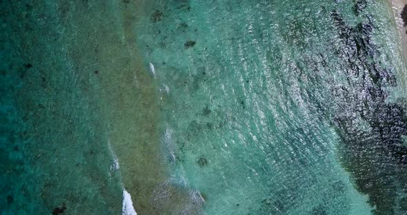 Natural fly over copy space shot of a summer white paradise sand beach and blue water background in 