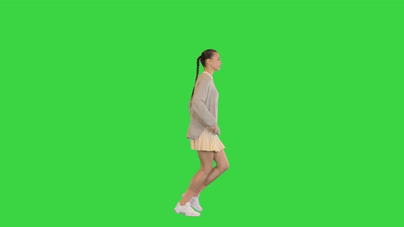 Happy Healthy Sporty Girl Running on a Green Screen Chroma Key