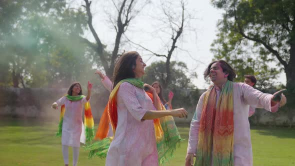Indian couple dancing at Holi party