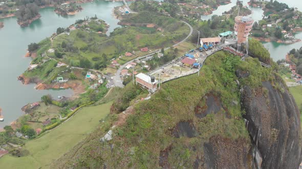 Aerial View Of Tourists At Rock of Guatape, El Peñon de Guatape In Inselberg, Colombia.