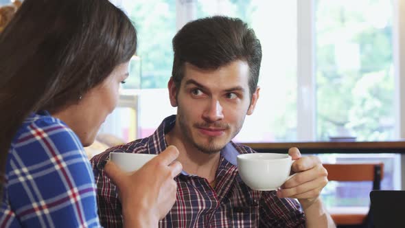 Shot of a Handsome Man Having Coffee with His Girlfriend