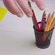 Closeup Hand Takes a Black Pencil From a Set of Pencils - VideoHive Item for Sale