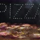 Delicious Fresh Italian Pizza On A Black Background With The Effect  Of Light Inscription Pizza - VideoHive Item for Sale
