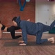 Man and Woman Doing Synchronous Leg Stretch Exercise on Floor Mat in Yoga Studio - VideoHive Item for Sale