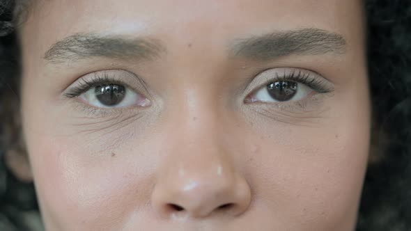 Close Up of Blinking Eyes of African Woman