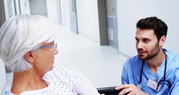 Nurse having a conversation with female senior patient