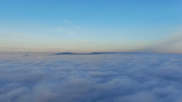 Aerial View in the Morning Above the Clouds