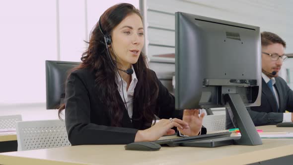 Business People Wearing Headset Working in Office