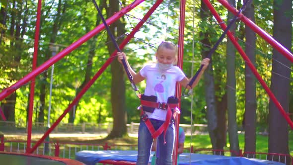 Girl Jumping on a Trampoline