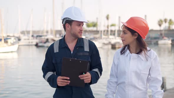 Workers Communicating During Workday in Marina
