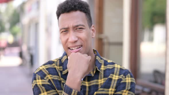 Outdoor Young African Man Thinking New Idea