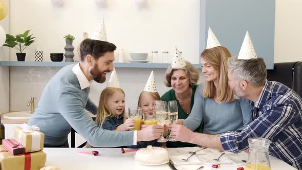 Family Celebrating Birthday in the Kitchen Together