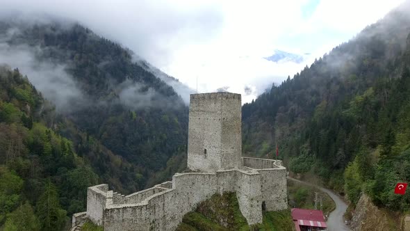 Fly Through Fog Towards Historic Castle