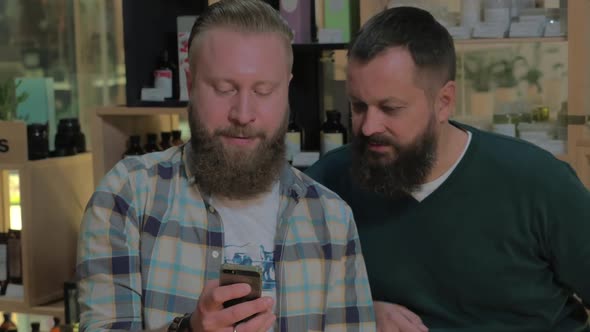 Two Bearded Men Using Smart Phone