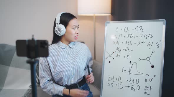 Asian Woman Chemistry Teacher Conducts a Lesson Online Live Broadcast of the Learning Process Using