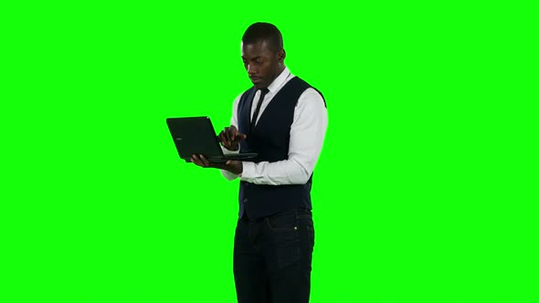 Businessman Using Laptop. Broker. Green Screen.